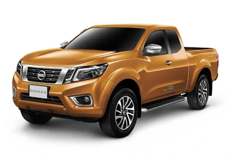 Orange Nissan Navara 4x4 pickup truck with alloy wheels and rugged off-road capability at KK Car Rental