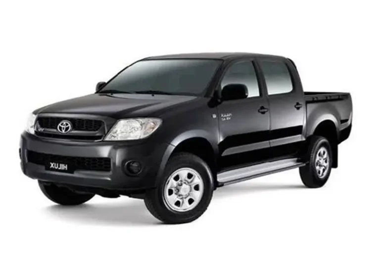 Black Toyota Hilux Vigo 2.5 automatic pickup truck with double cab and alloy wheels at KK Car Rental