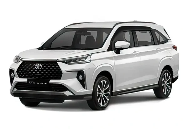 Modern Toyota Veloz in pearl white with bold black grille design, efficient 7-seater SUV available at KK car rental