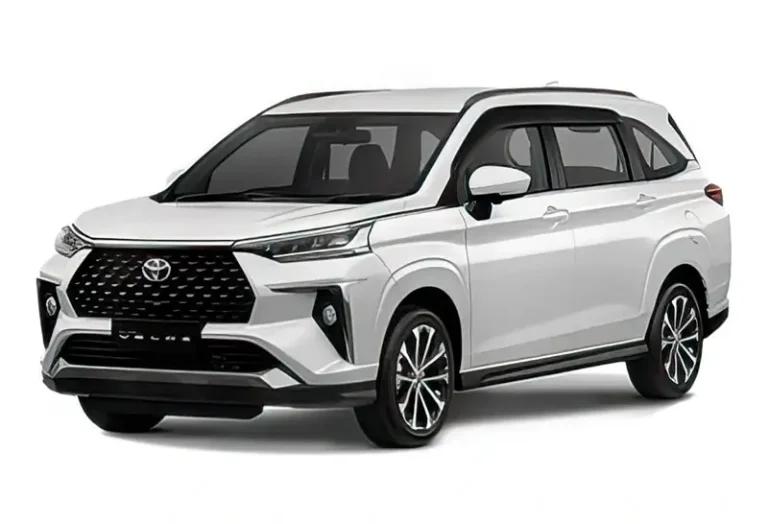 Modern Toyota Veloz in pearl white with bold black grille design, efficient 7-seater SUV available at KK car rental